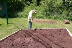 Erwin Karl broadcasts wildflower seeds